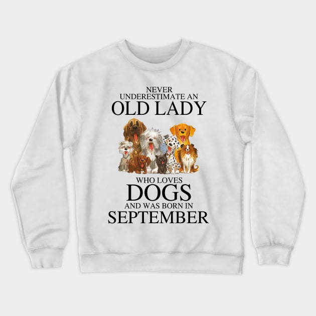 Never Underestimate An Old Lady Who Loves Dogs And Was Born In September Crewneck Sweatshirt by louismcfarland